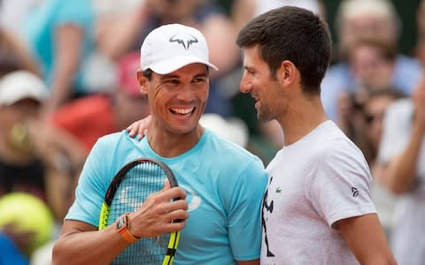 Rafael Nadal of Spain and Novak Djokovic of Serbia while playing a tie break doubles exhibition match against Simone Halep of Romania and Alexander Zverev of Germany on Court Philippe Chatrier during a packed Children's Day at Roland Garros before the start of the 2018 French Open Tennis Tournament at Roland Garros on May 26th 2018 in Paris, France - Credit: Getty Images&nbsp;