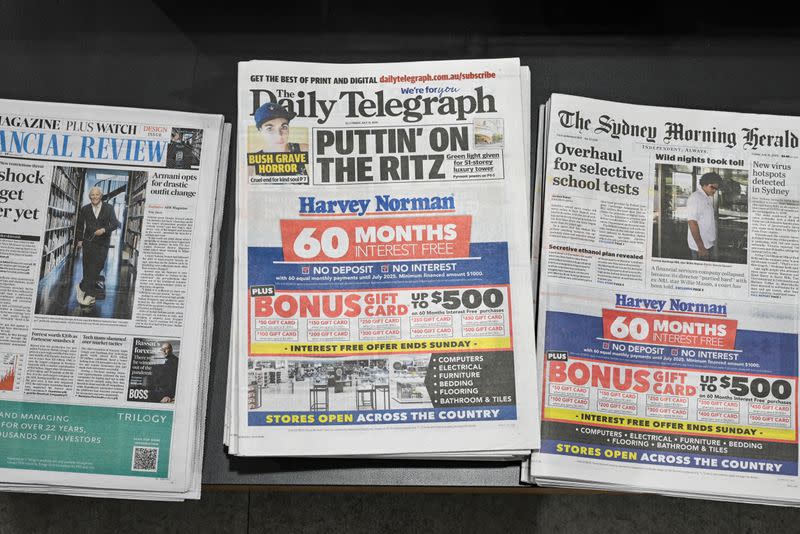 Newspapers are seen for sale at a shop in Sydney