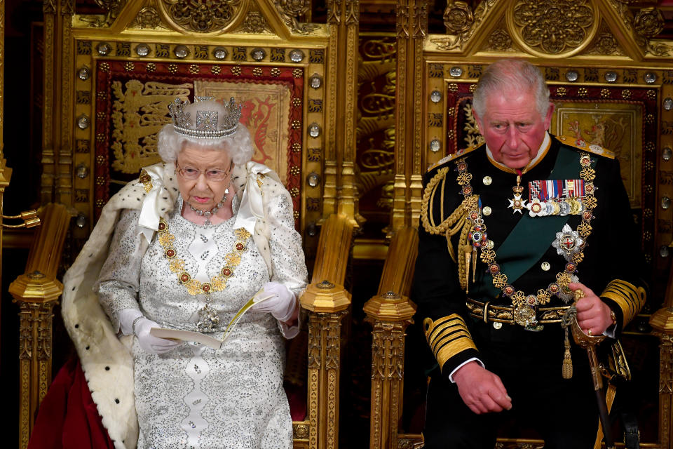 LONDON, ENGLAND - OCTOBER 14: Queen Elizabeth II with Prince Charles, Prince of Wales as she delivers the Queen's Speech during the State Opening of Parliament at the Palace of Westminster on October 14, 2019 in London, England. The Queen's speech is expected to announce plans to end the free movement of EU citizens to the UK after Brexit, new laws on crime, health and the environment. (Photo by Victoria Jones - WPA Pool / Getty Images)