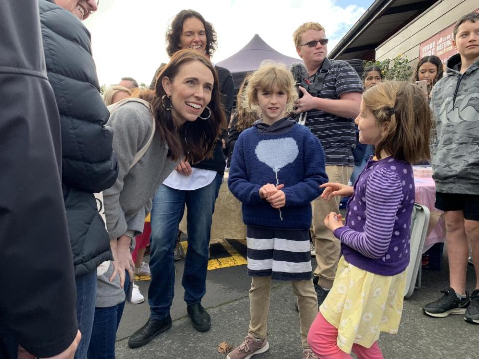 Jacinda Ardern talks to children at the Grey Lynn farmers market on Sunday