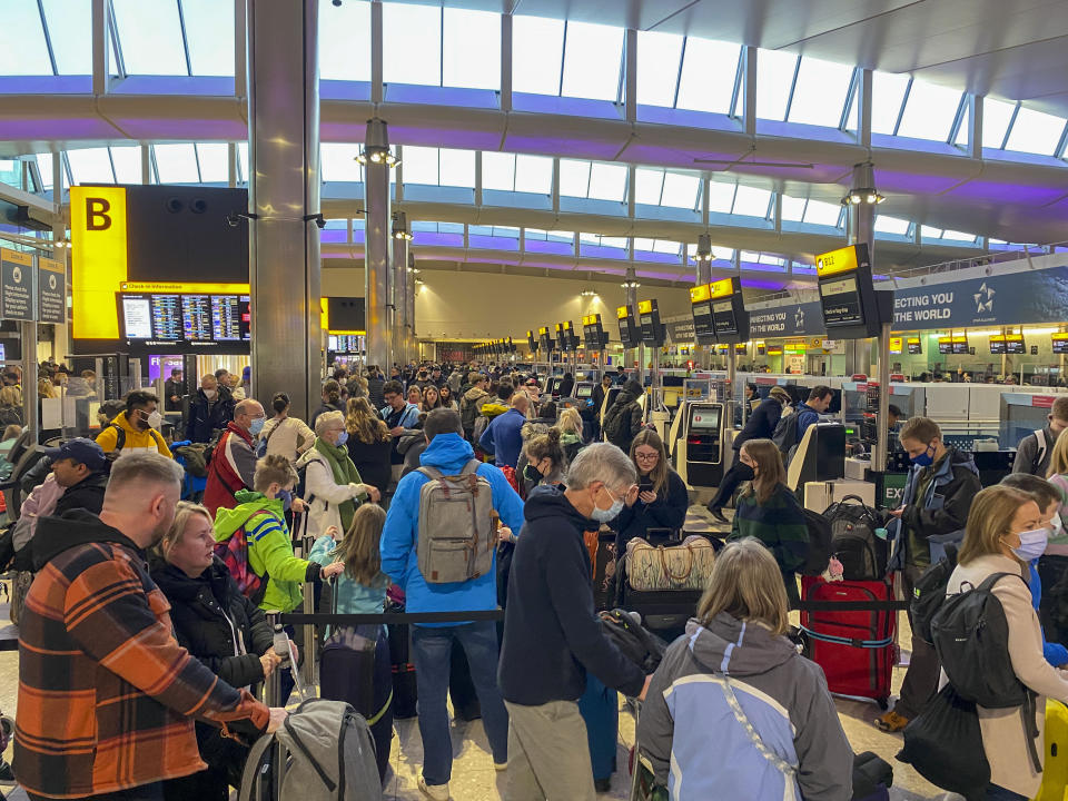 File photo dated 09/04/22 of passengers check-in in terminal 2 at Heathrow Airport, west London. Holidaymakers are being urged to use unspent vouchers worth �85 million before they lose financial protection. Issue date: Tuesday April 26, 2022.