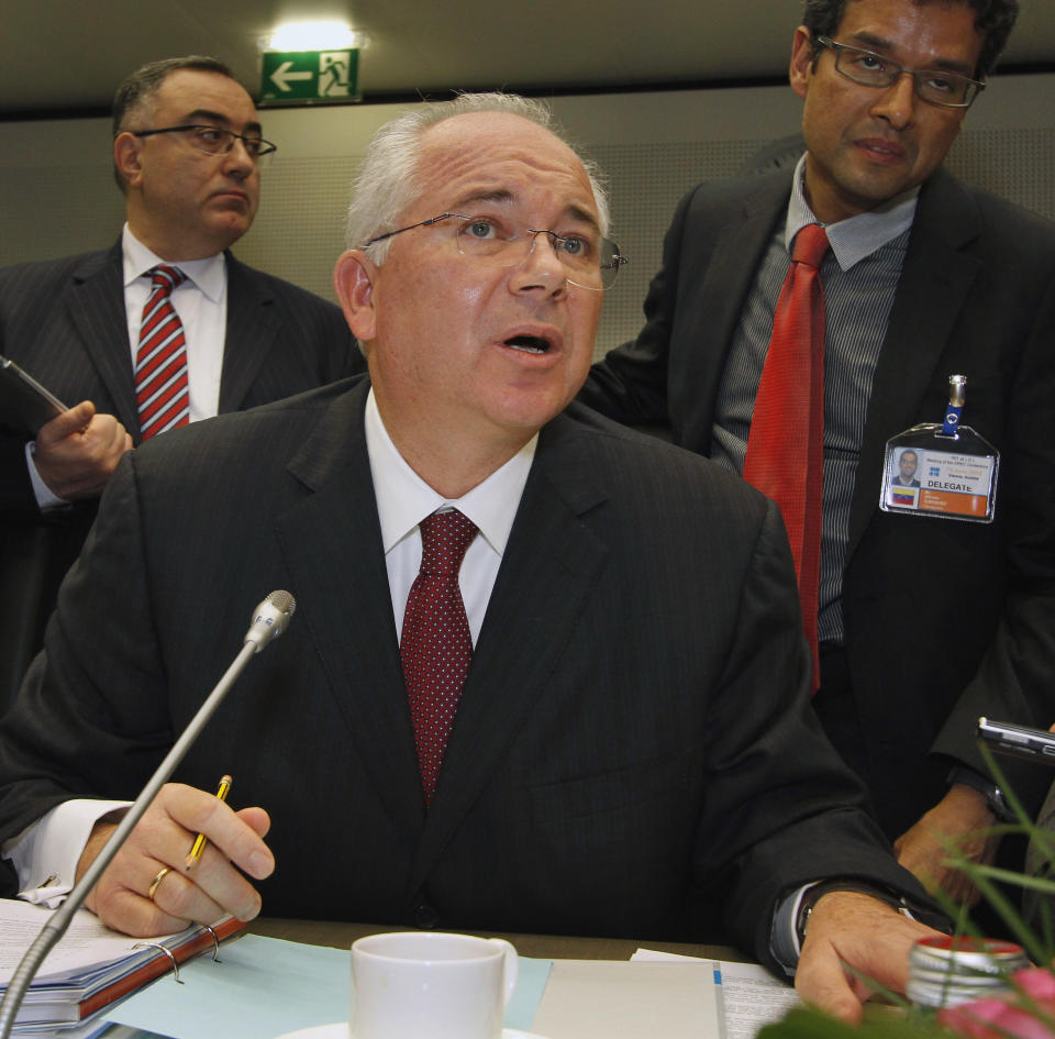 Venezuela's Minister of Energy and Petroleum Rafael D Ramirez speaks to journalists prior to the start of the meeting of the Organization of the Petroleum Exporting Countries, OPEC, at their headquarters in Vienna, Austria, on Thursday, June 14, 2012. (AP Photo/Ronald Zak)