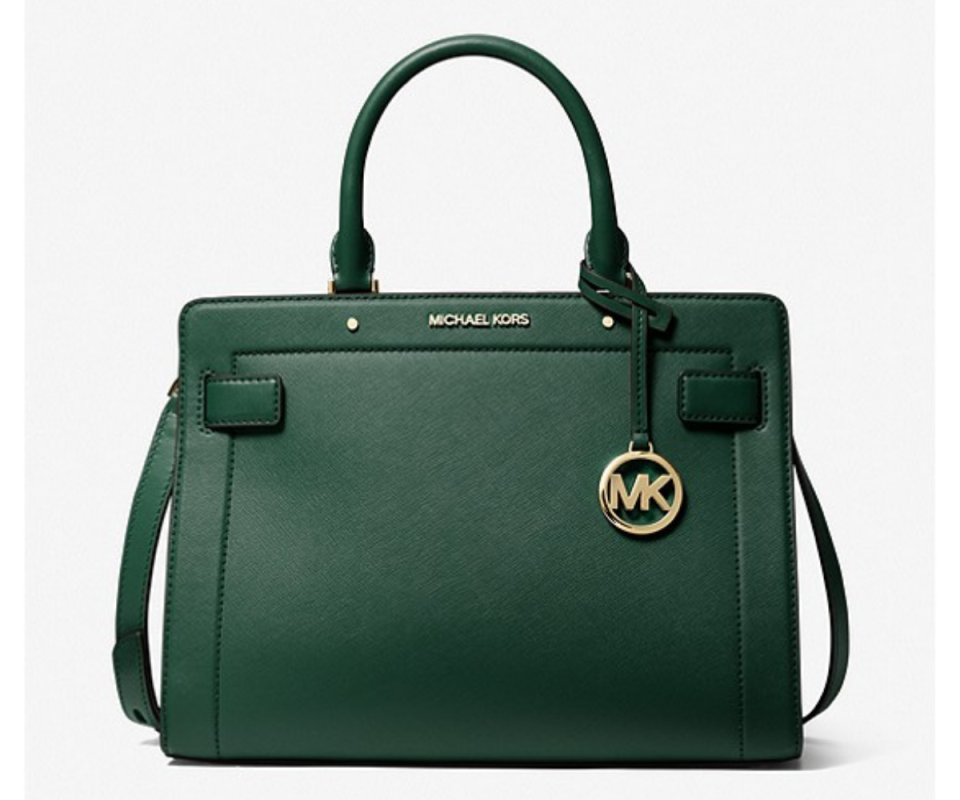 A dark moss green tote Michael Kors handbag against a white background.