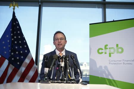 Office of Management and Budget (OMB) Director Mick Mulvaney speaks to the media at the U.S. Consumer Financial Protection Bureau (CFPB), where he began work earlier in the day after being named acting director by U.S. President Donald Trump in Washington November 27, 2017. REUTERS/Joshua Roberts