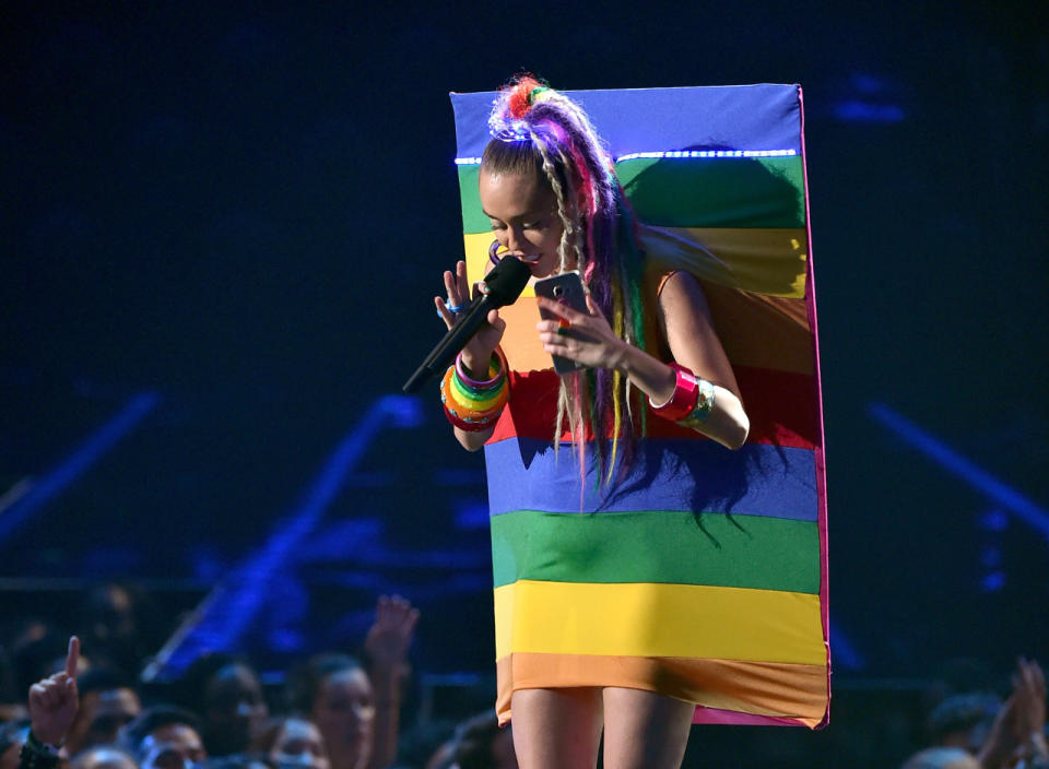 Miley Cyrus as a rainbow milk carton.