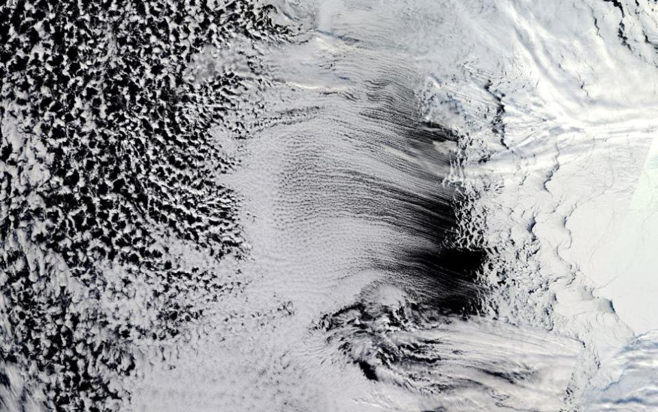 <p> Long, parallel bands of cumulus clouds (called cloud streets) stretch over the Amundsen Sea off West Antarctica in this image captured from space on Sept. 12, 2018. The puffy sky streaks likely formed as cool air blowing from Antarctica and the sea ice hit warmer open waters, picking up heat and rising into the atmosphere. There, these so-called thermals would have bumped into a layer of warm air, a lid of sorts, causing &quot;the rising thermals to roll over and loop back on themselves,&quot; according to NASA. On the upper side of these &quot;cylinders of rotating air,&quot; NASA said, clouds form. </p>