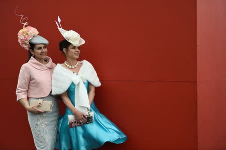 Racegoers attend the Punchestown Racecourse in Naas, Ireland, April 27, 2017. REUTERS/Clodagh Kilcoyne