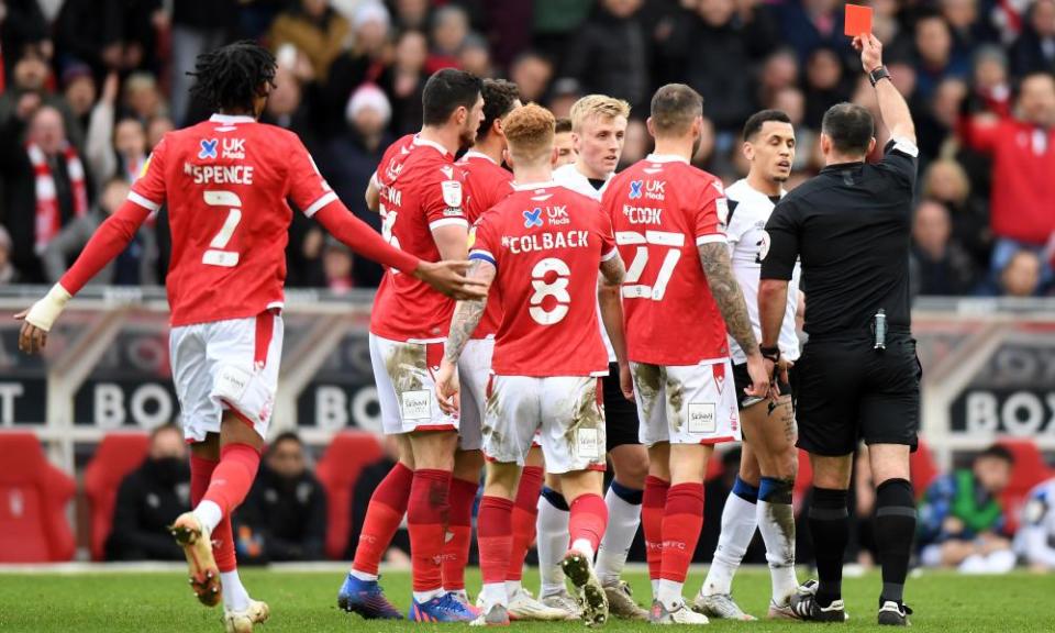 Ravel Morrison of Derby is shown a red card in added time at the end of the game