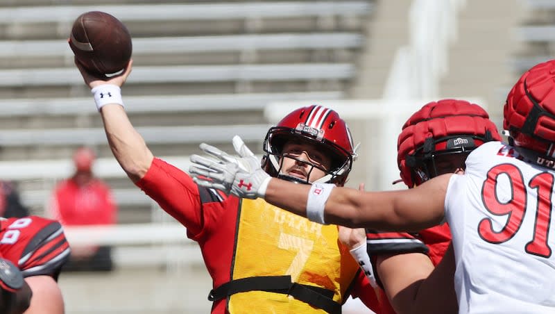 Utah Utes quarterback Cameron Rising (7) throws under pressure from Utah Utes defensive end Jonah Lea'ea (91) during the 22 Forever game scrimmage in Salt Lake City on Saturday, April 13, 2024.