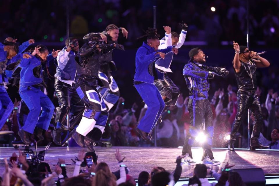 Usher performs onstage during the halftime show at Super Bowl LVIII.