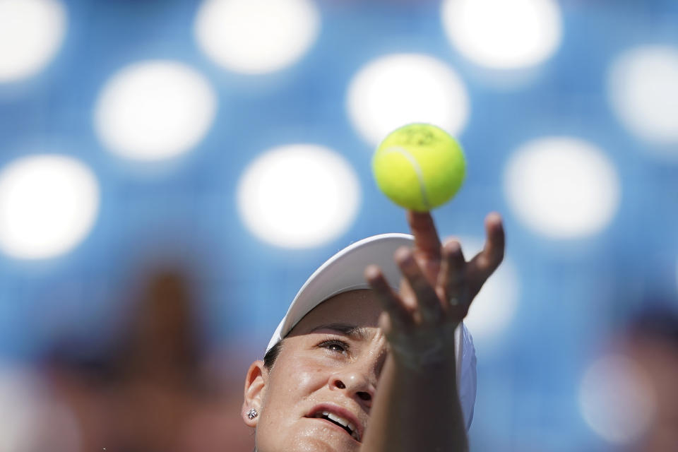 Ashleigh Barty, of Australia, serves to Svetlana Kuznetsova, of Russia, during the Western & Southern Open tennis tournament, Saturday, Aug. 17, 2019, in Mason, Ohio. (AP Photo/John Minchillo)