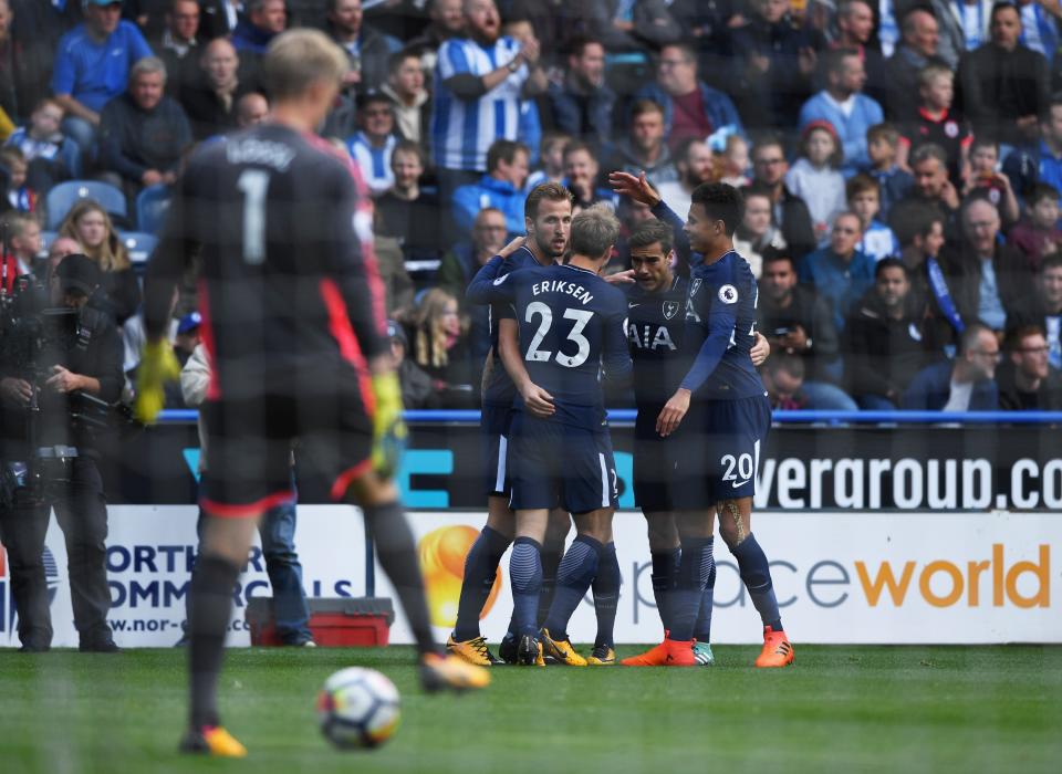 <p>Harry Kane of Tottenham Hotspur celebrates scoring his sides first goal with his Tottenham Hotspur team mates (Photo by Gareth Copley/Getty Images) </p>