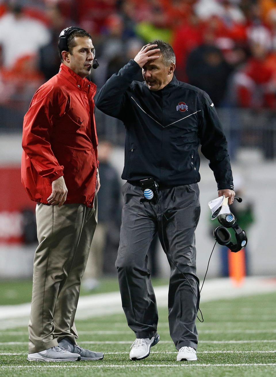Ohio State Buckeyes head coach Urban Meyer walks past defensive coordinator Luke Fickell during the fourth quarter of the NCAA football game at Ohio Stadium in Columbus on Nov. 21, 2015. Michigan State won 17-14. (Adam Cairns / The Columbus Dispatch)