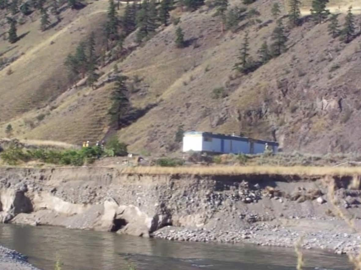 On July 31, a contractor hired by the Thompson-Nicola Regional District excavated the house trailer, which stood on a portion of land that had been badly damaged by extensive flooding last November, putting the house at risk of falling into the Nicola River. (Michael Brandie Coutts MacArthur/Facebook - image credit)