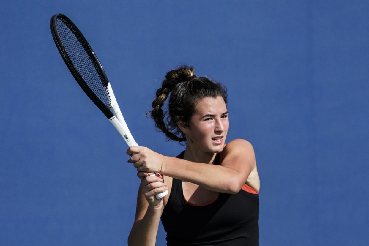 Hoover's Tess Bucher returns the ball during this year's OHSAA State Tennis Championships.