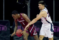 Liberty's Kyle Rode, right, knocks the ball away from South Carolina's T.J. Moss (1) during the second half of an NCAA college basketball game Saturday, Nov. 28, 2020, at the T-Mobile Center in Kansas City, Mo. (AP Photo/Charlie Riedel)