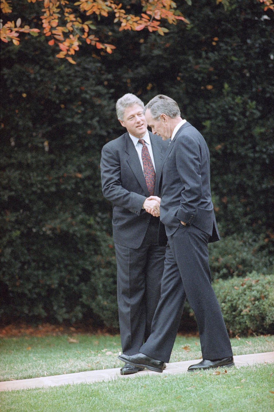 <p> FILE - In this Nov. 18, 1992 file photo, President George H.W. Bush shakes hands with President-elect Bill Clinton after an Oval Office meeting in Washington. (AP Photo/Greg Gibson) </p>