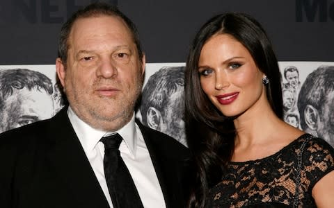 In this Dec. 3, 2012 file photo, producer Harvey Weinstein, left, and his wife, fashion designer Georgina Chapman attend the Museum of Modern Art Film Benefit Tribute to Quentin Tarantino in New York - Credit: AP