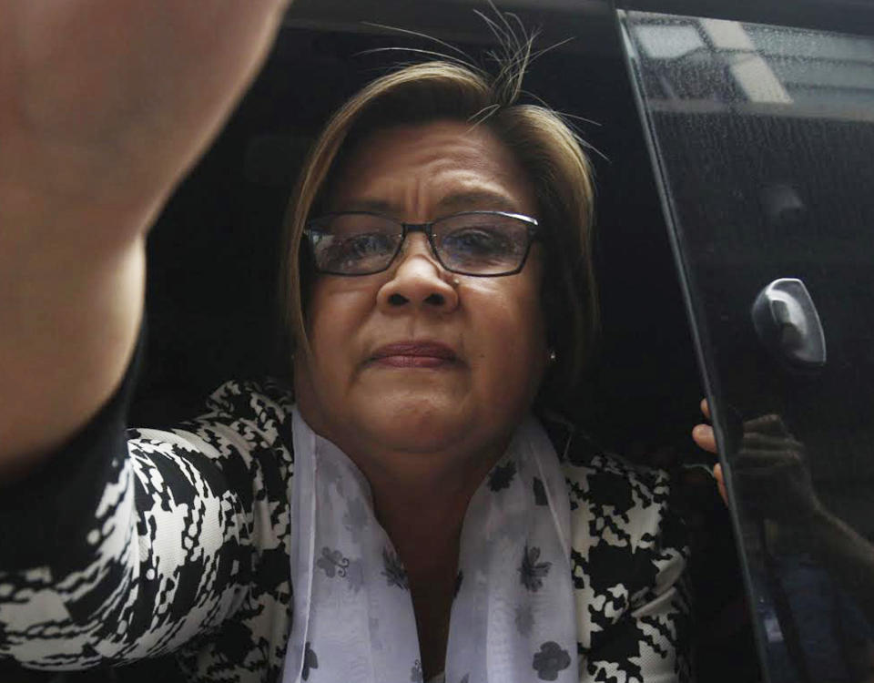 FILE - Philippine then opposition Senator Leila de Lima arrives at a regional trial court for a brief personal appearance Friday, Feb. 24, 2017, in Paranaque city southeast of Manila, Philippines. Philippine police killed three inmates, including a top Abu Sayyaf militant, after they stabbed a jail officer and briefly held a detained former opposition Senator Leila de Lima Sunday in a failed attempt to escape from the police headquarters in the capital region, police said. (AP Photo, File)