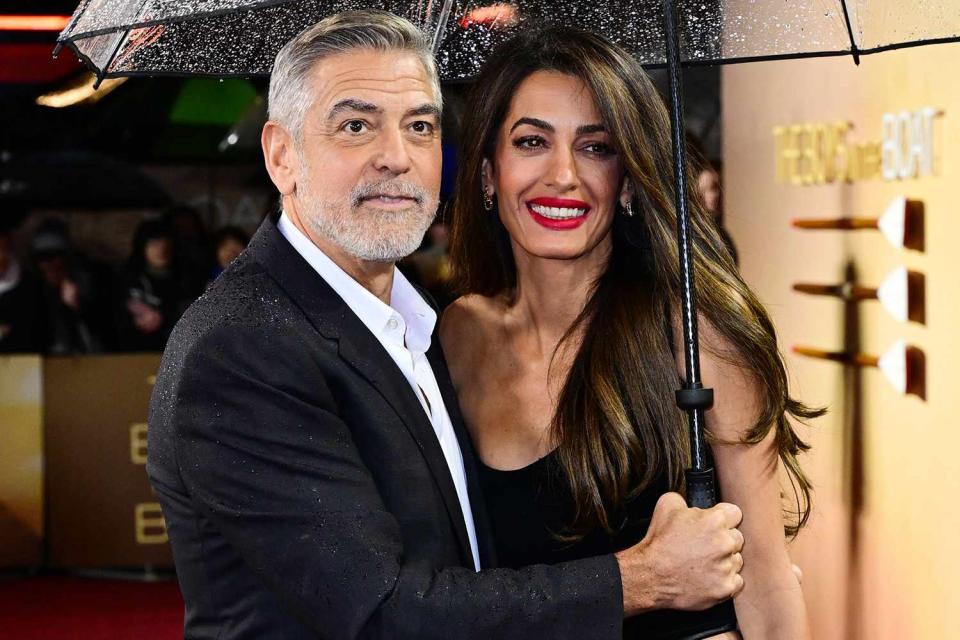 <p>Anthony Harvey/Shutterstock</p> George Clooney and Amal Clooney attend 