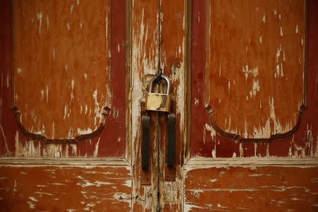 The locked door of a neighbourhood mosque is seen in Kashgar, Xinjiang Uighur Autonomous Region, China, March 23, 2017. REUTERS/Thomas Peter