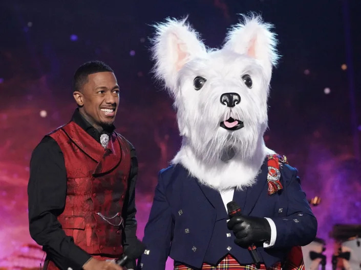 nick cannon and mcterrier, a person in a scottish terrier dog costume with a full kilt outfit, on the masked singer