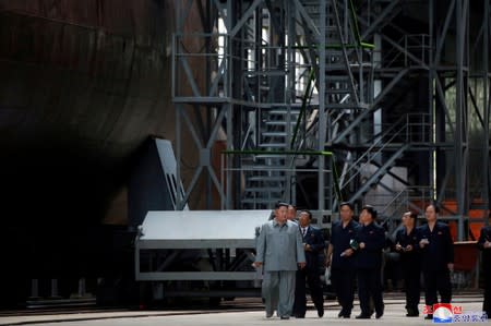 North Korean leader Kim Jong Un visits a submarine factory in an undisclosed location, North Korea