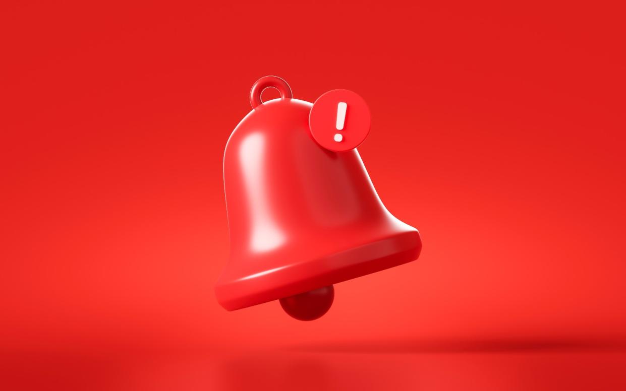  Illustrated red bell with cell phone notification. 