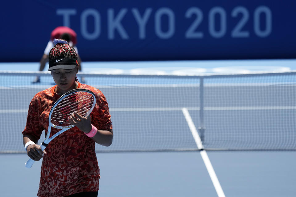 Naomi Osaka, of Japan, practices ahead of the 2020 Summer Olympics at Ariake Tennis Center, Monday, July 19, 2021, in Tokyo. (AP Photo/Kiichiro Sato)