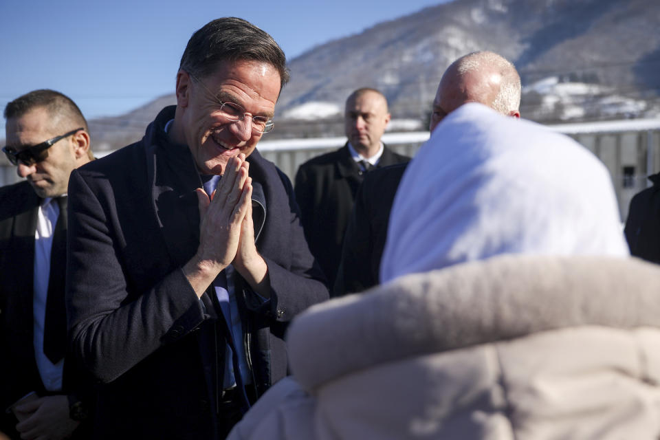 Prime Minister of the Netherlands, Mark Rutte, left, shares a word with members of Mothers of Srebrenica association, at the Srebrenica Memorial Center in Potocari, Bosnia, Monday, Jan. 22, 2024. (AP Photo/Armin Durgut)