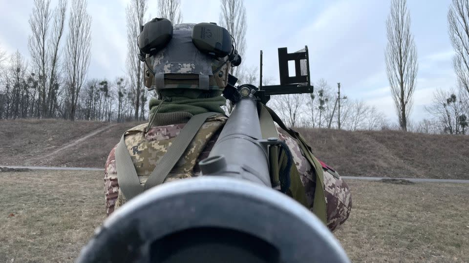 "Smeta," a soldier from a mobile air defense unit guarding the approaches to Kyiv, practices with a training unit for the US-made Stinger missile system. Some of the hand-held US missiles used by the mobile air defense units were manufactured in the 1980s, the unit said, years before some of the soldiers were born. - Joseph Ataman/CNN