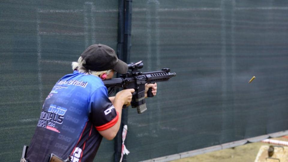 Lynette Oxley shooting a gun in South Africa