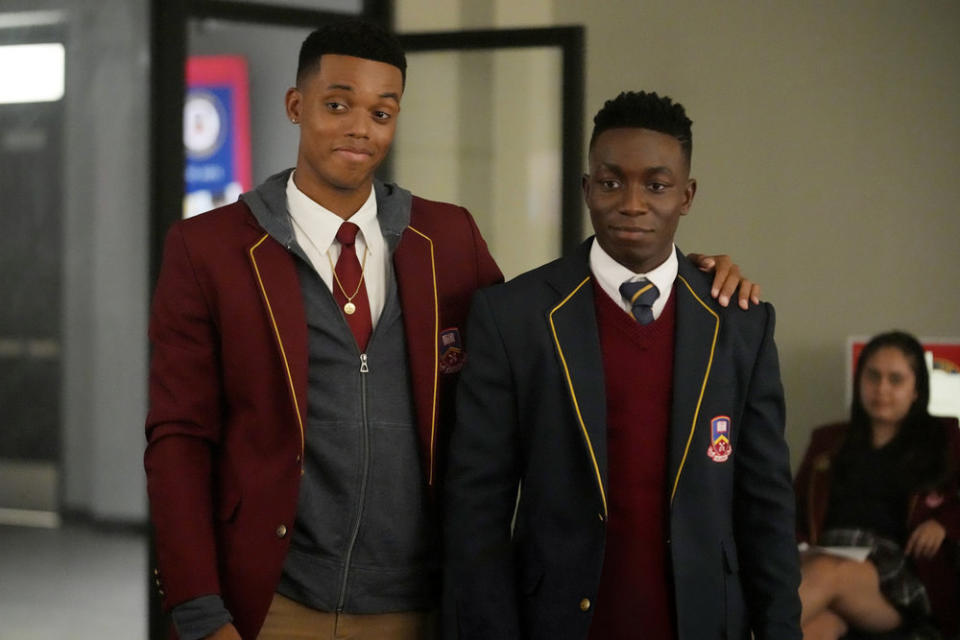 two teens in school uniform