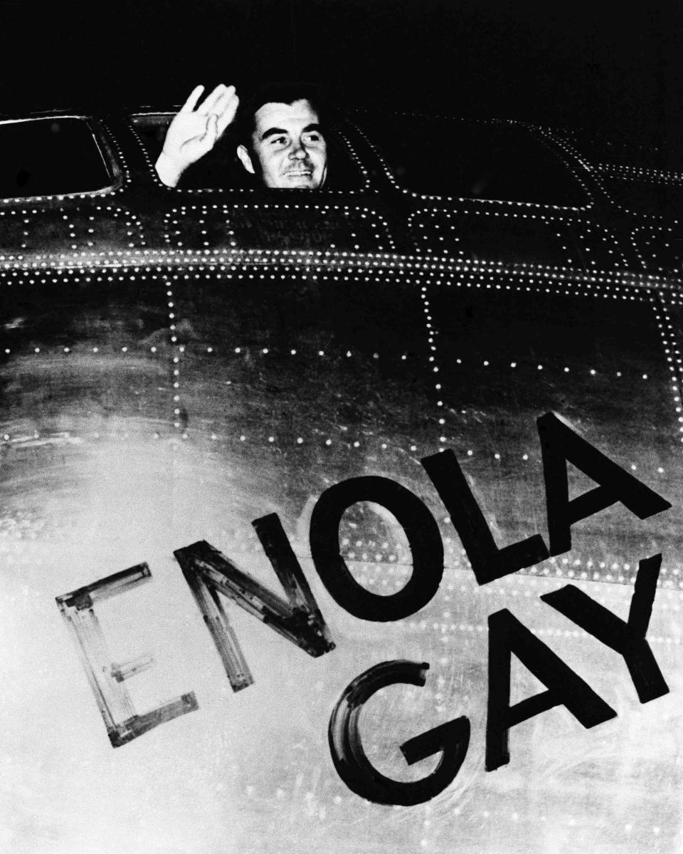 Colonel Paul Tibbets waves from his cockpit before takeoff from Tinian Island, on August 6, 1945.
