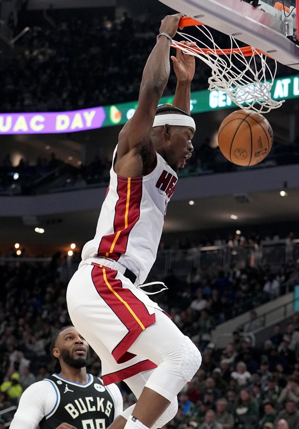 Miami Heat forward Jimmy Butler (22) dunks the ball during the first half of their game Sunday, April 16, 2023 at Fiserv Forum in Milwaukee, Wis. The Miami Heat beat the Milwaukee Bucks 130-117.