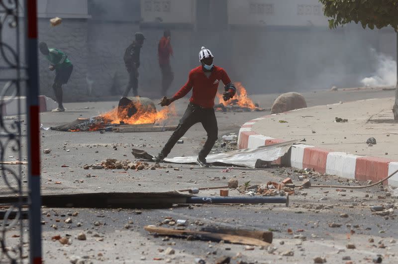 Supporters of opposition leader Ousmane Sonko clash with security forces, in Dakar