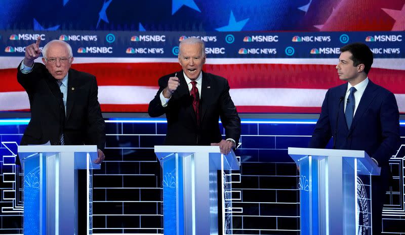 FILE PHOTO: Senator Sanders and former Vice President Biden speak at the ninth Democratic 2020 U.S. Presidential candidates debate in Las Vegas Nevada, U.S.