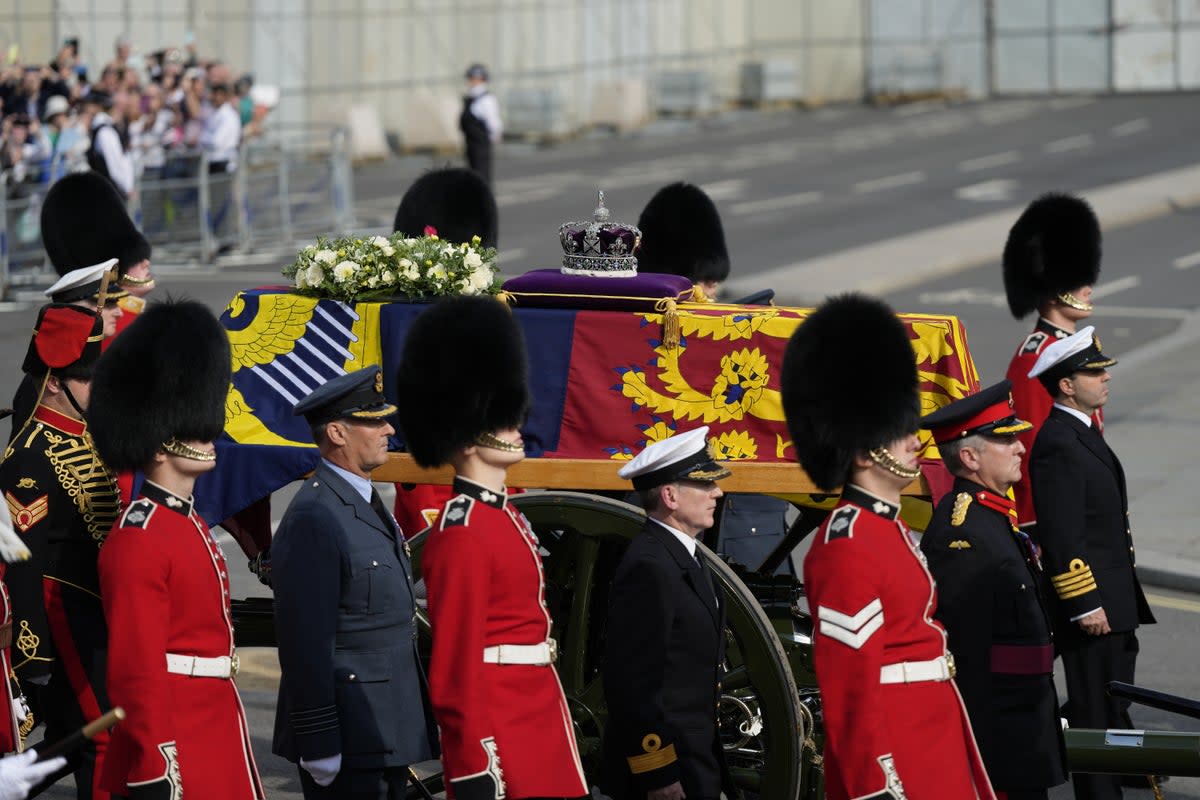 The coffin of the Queen is carried on a horse-drawn gun carriage (Frank Augstein/PA) (PA Wire)