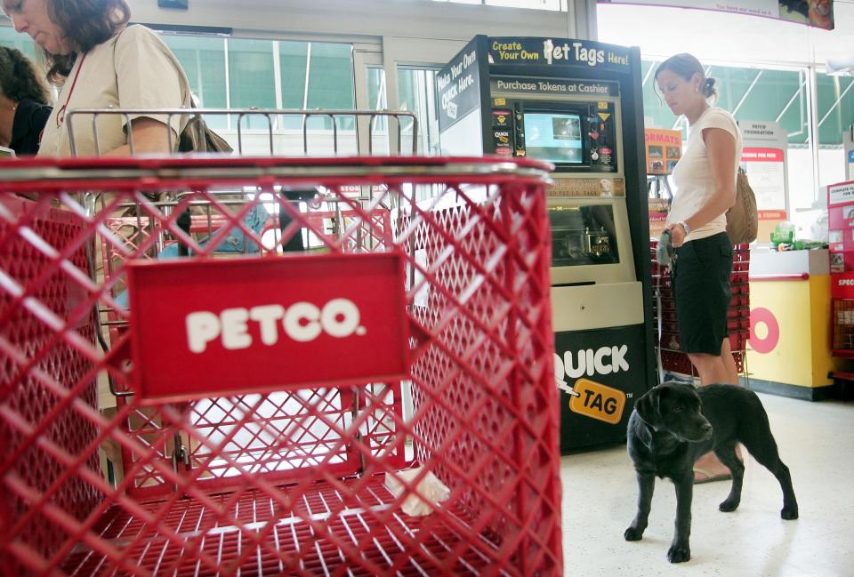 CHICAGO - JULY 14: Shoppers look over the merchadise at a Petco store July 14, 2006 in Chicago, Illinois. Texas Pacific Group and Leonard Green & Partners LP agreed to acquire the animal supplies retailer for $29 a share, 49 percent more yesterday's closing price.  (Photo by Scott Olson/Getty Images)