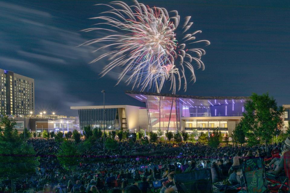 People watch fireworks at the end of the annual Oklahoma City Philharmonic Red, White, and Boom outdoor concert at Scissortail Park in Downtown Oklahoma City on Monday, July 3, 2023.