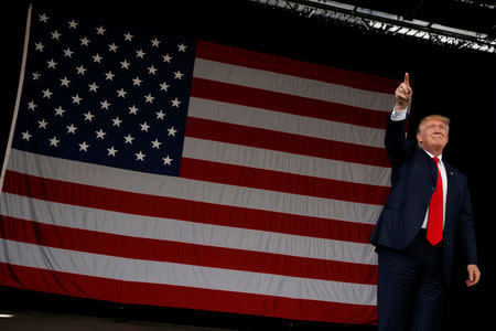 Republican U.S. presidential nominee Donald Trump takes the stage to rally with supporters in St. Augustine, Florida, U.S. October 24, 2016. REUTERS/Jonathan Ernst