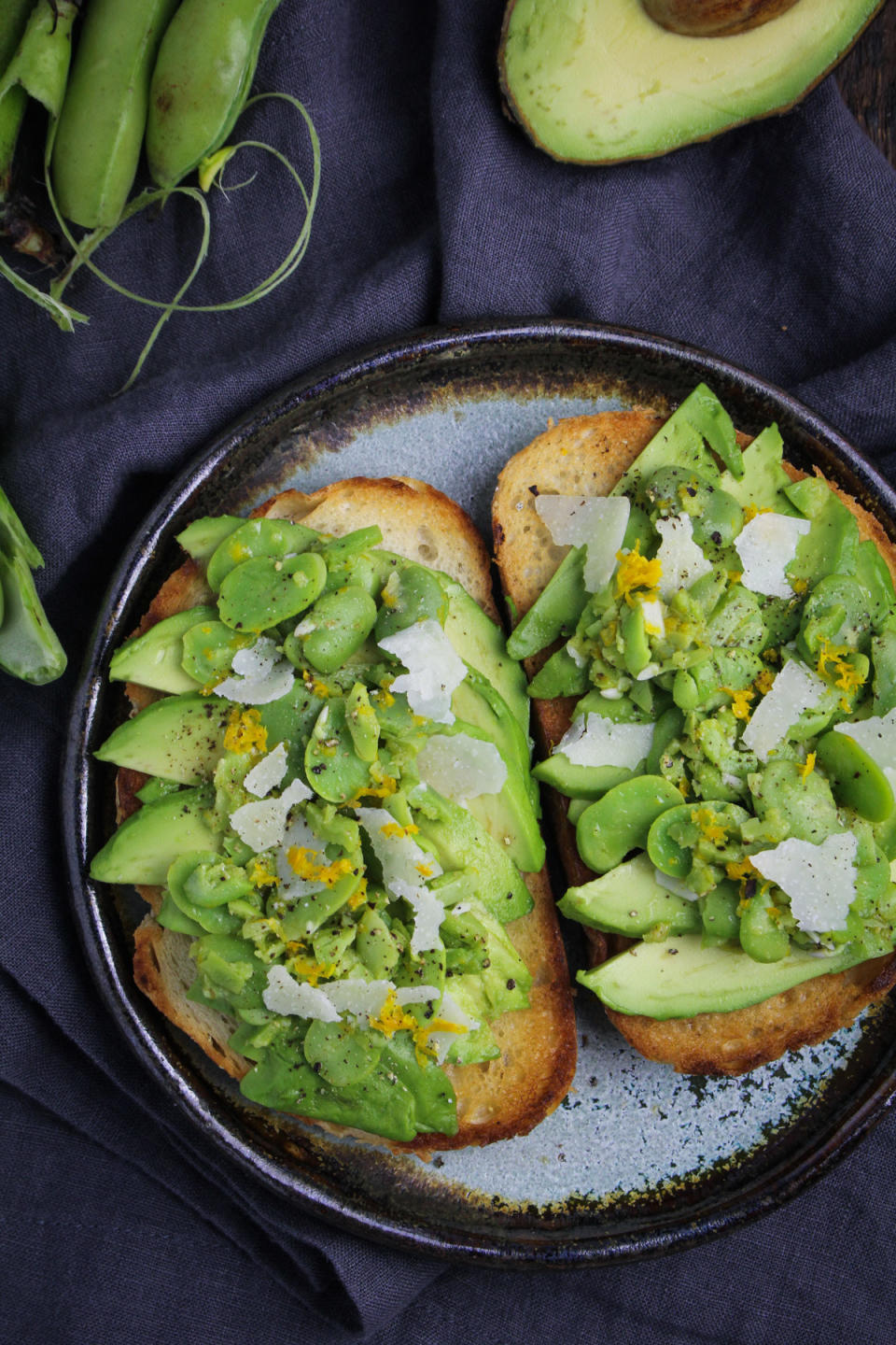 Avocado toast with fava beans and cheese.