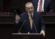 Turkey's President Recep Tayyip Erdogan addresses his ruling party lawmakers at the parliament, in Ankara, Turkey, Wednesday, Oct. 28, 2020. Erdogan told his ruling party's legislators on Wednesday that he had a fruitful telephone conversation with Russian President Vladimir Putin the previous evening, during which he proposed that Ankara and Moscow work together to resolve the conflict by using their influence on the Azerbaijani and Armenian leaders. (AP Photo)