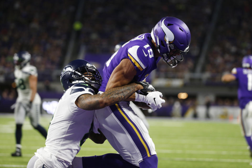 Minnesota Vikings wide receiver Brandon Zylstra catches a 4-yard touchdown pass in front of Seattle Seahawks cornerback Jamar Taylor, left, during the second half of an NFL preseason football game, Sunday, Aug. 18, 2019, in Minneapolis. (AP Photo/Bruce Kluckhohn)