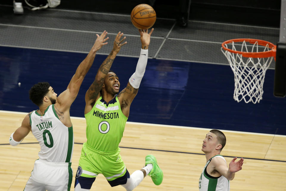 Minnesota Timberwolves guard D'Angelo Russell (0) shoots in front of Boston Celtics forward Jayson Tatum (0) and guard Payton Pritchard (11) in the first quarter during an NBA basketball game, Saturday, May 15, 2021, in Minneapolis. (AP Photo/Andy Clayton-King)