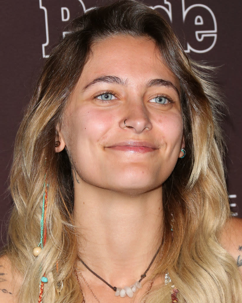 Close-up of Paris, with a nose ring, smiling