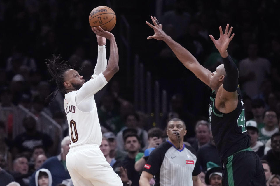 Cleveland Cavaliers guard Darius Garland (10) shoots against Boston Celtics center Al Horford (42) during the second half of Game 5 of an NBA basketball second-round playoff series Wednesday, May 15, 2024, in Boston. The Celtics advanced to the Eastern Conference finals. (AP Photo/Charles Krupa)