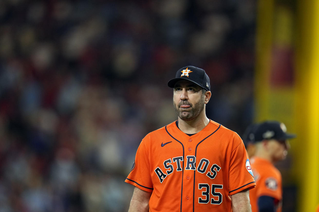 Houston Astros starting pitcher Justin Verlander walks toward the dugout after being pulled during the sixth inning in Game 5 of the baseball American League Championship Series against the Texas Rangers Friday, Oct. 20, 2023, in Arlington, Texas. (AP Photo/Julio Cortez)