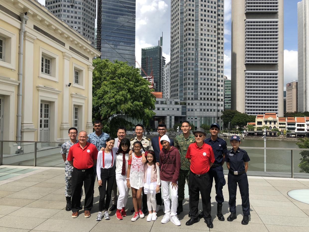 NDP 2019 executive committee chair Brigadier-General Yew Chee Leung (back row, 4th from left) with key performers and personnel from National Day Parade 2019, on Wednesday, 22 May 2019. PHOTO: Nicholas Yong/Yahoo News Singapore