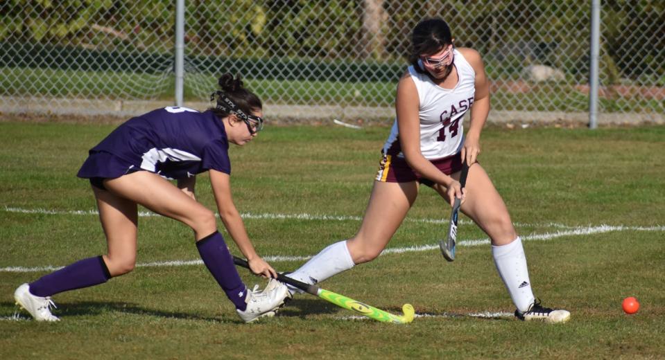 Case's Adalynn Carreiro and Bourne's Taylor Dodge fight for the ball in their field hockey game in Swansea on Wednesday.